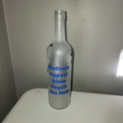 Feathers Appear when Angels are Near Bottle with Fairy Lights