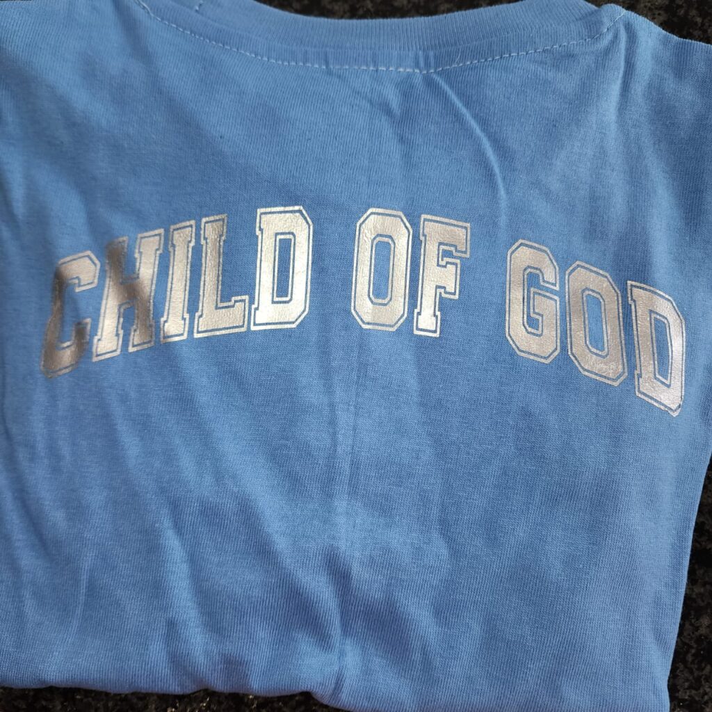 Blue T-shirt with Silver Print (4-5 Years) print is on the back